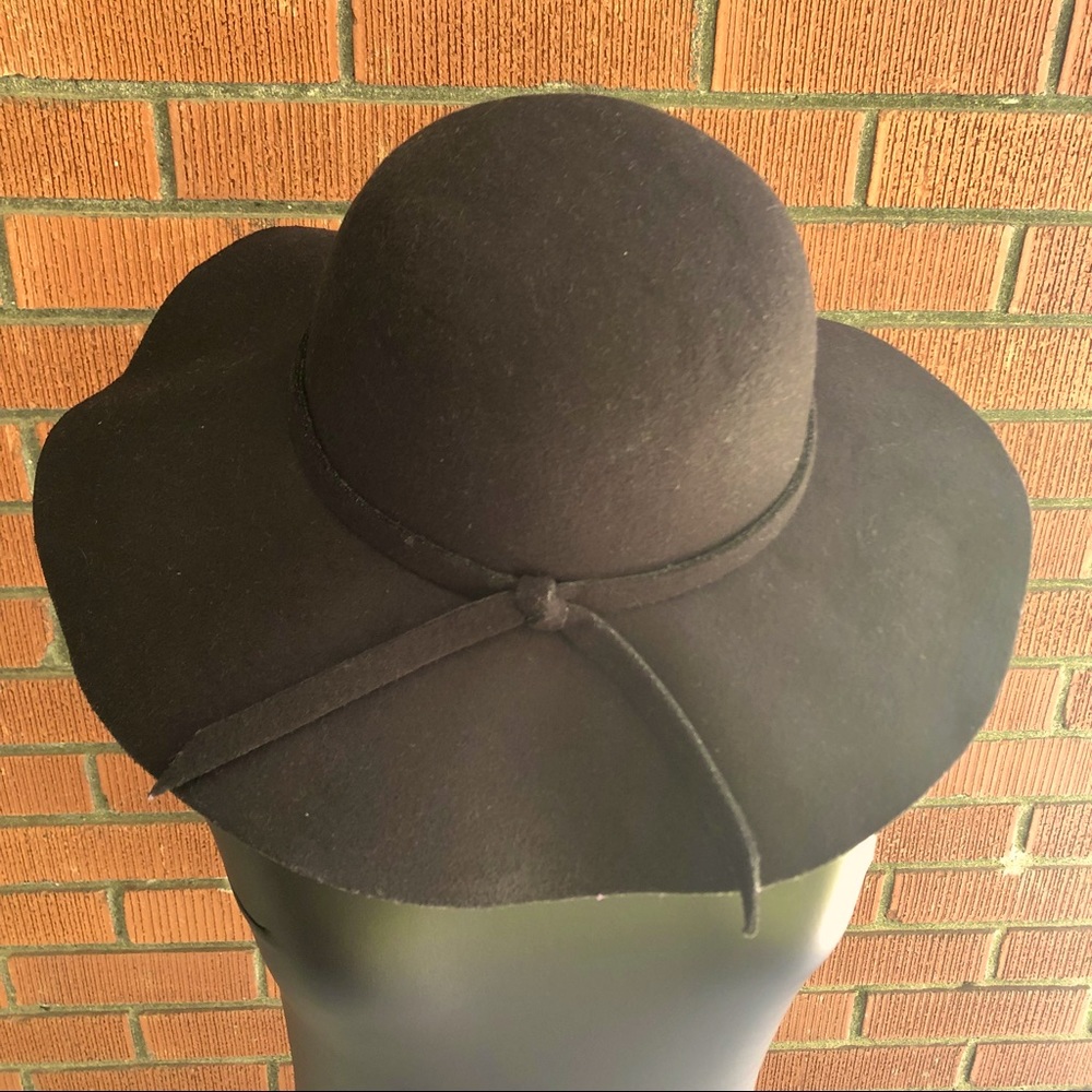 Black felt hat full brim with simple tie and round top, slightly floppy brim